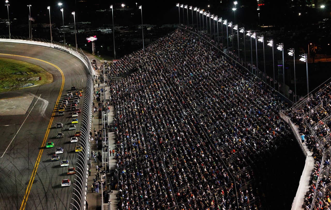 DAYTONA BEACH, FL - FEBRUARY 27:  Cars race down the frontstretch during the NASCAR Sprint Cup Series Daytona 500 at Daytona International Speedway on February 27, 2012 in Daytona Beach, Florida.  (Photo by Tom Pennington/Getty Images for NASCAR)