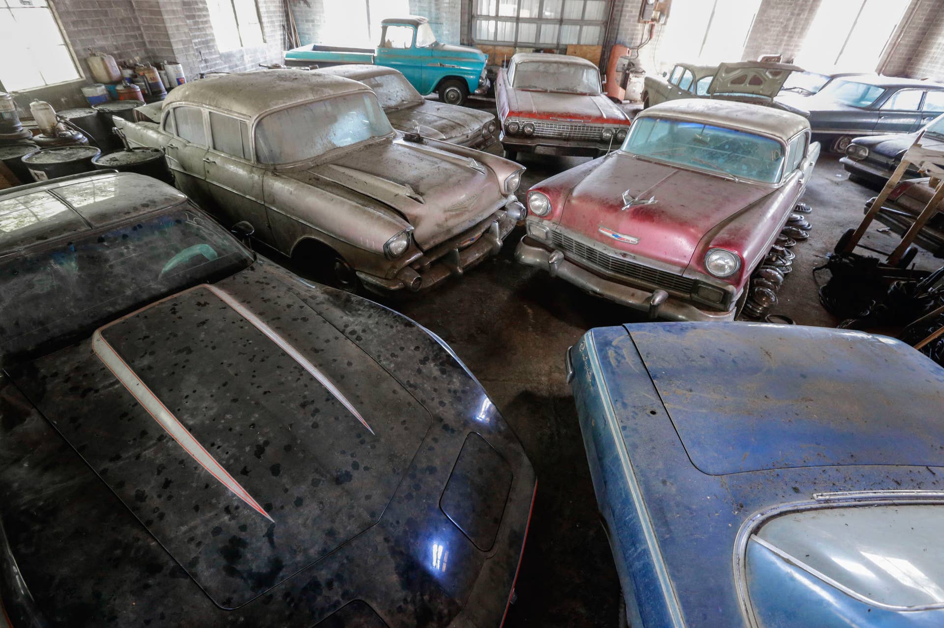 In this Aug. 12, 2013 photo, old Chevrolet automobiles fill the showroom of the former Lambrecht Chevrolet car dealership in Pierce, Neb. Next month, bidders from at least a dozen countries and all 50 U.S. states will converge on Pierce, a town of about 1,800 in northeast Nebraska, for a two-day auction that will feature about 500 old cars and trucks, mostly Chevrolets that went unsold during the dealership?s five decades in business. About 50 have fewer than 20 miles on the odometer, and some are so rare that no one has established a price. The most valuable could fetch six-figure bids. (AP Photo/Nati Harnik)