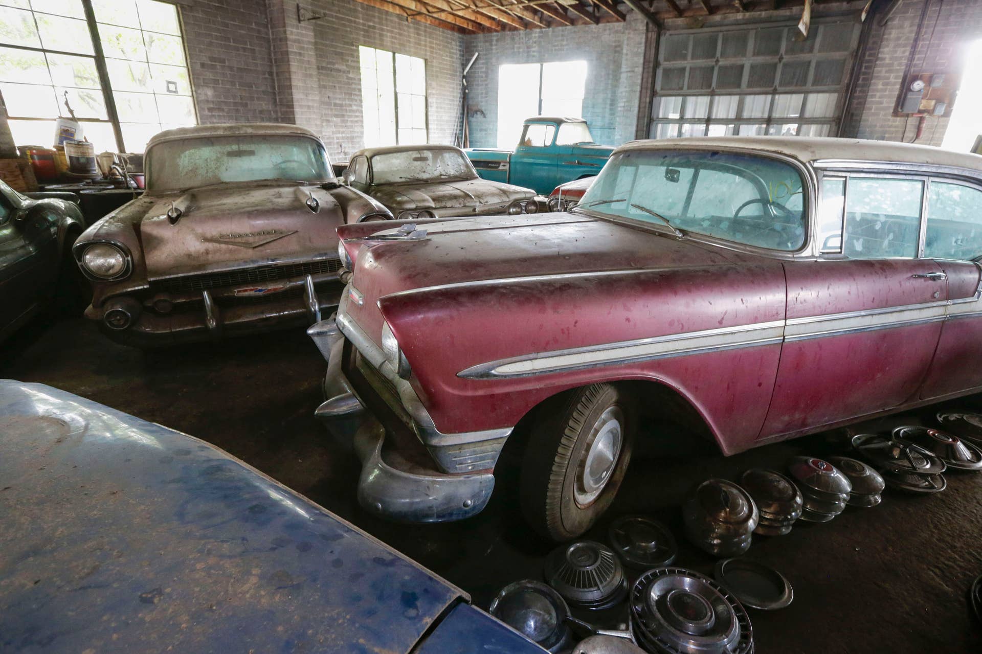 In this Aug. 12, 2013 photo, old Chevrolet automobiles fill the showroom of the former Lambrecht Chevrolet car dealership in Pierce, Neb. Next month, bidders from at least a dozen countries and all 50 U.S. states will converge on Pierce, a town of about 1,800 in northeast Nebraska, for a two-day auction that will feature about 500 old cars and trucks, mostly Chevrolets that went unsold during the dealership?s five decades in business. About 50 have fewer than 20 miles on the odometer, and some are so rare that no one has established a price. The most valuable could fetch six-figure bids. (AP Photo/Nati Harnik)