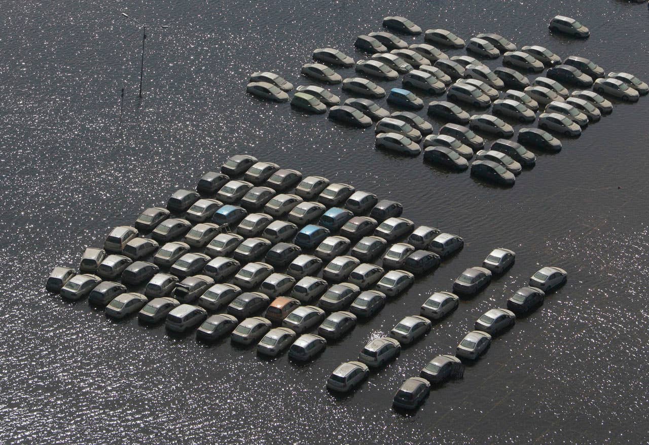 Vehicles at Honda auto factory are submerged in floodwaters at the Rojana industrial district in Ayutthaya, central Thailand Wednesday, Nov. 23, 2011. Honda's auto factory in Thailand remains closed because of the floodwaters. (AP Photo/Sakchai Lalit)