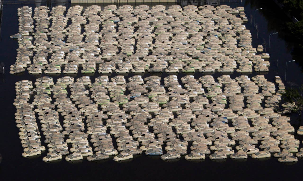 Vehicles at Honda auto factory are submerged in floodwaters at the Rojana industrial district in Ayutthaya, central Thailand Wednesday, Nov. 23, 2011. Honda's auto factory in Thailand remains closed because of the floodwaters. (AP Photo/Sakchai Lalit)