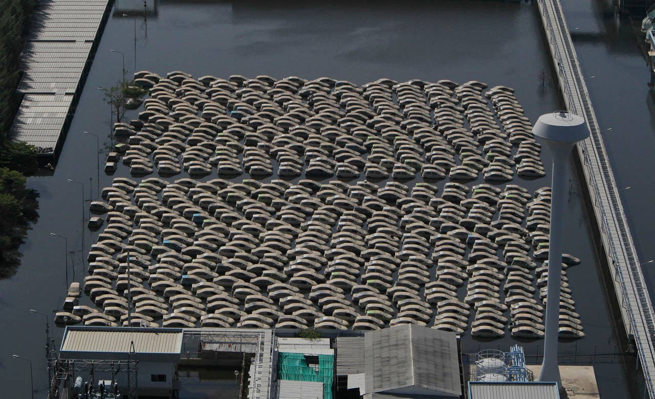 Vehicles at Honda auto factory are submerged in floodwaters at the Rojana industrial district in Ayutthaya, central Thailand Wednesday, Nov. 23, 2011. Honda's auto factory in Thailand remains closed because of the floodwaters. (AP Photo/Sakchai Lalit)
