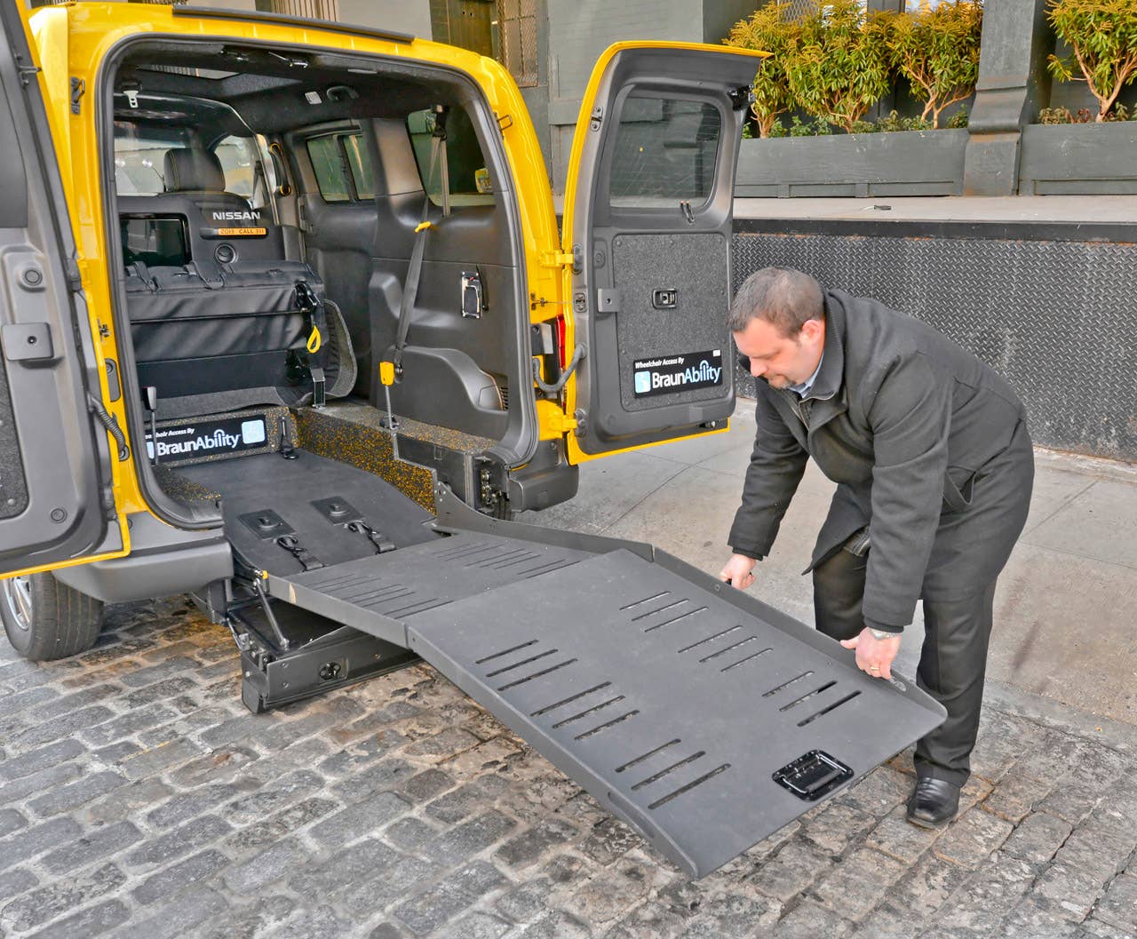 NEW YORK (Mar. 27, 2013)  As Nissans innovative NV200 taxi gets ready to take to the streets of New York City this coming fall, another crucial part of the Taxi of Tomorrow program was unveiled today at the New York International Auto Show  the wheelchair accessible NV200 Mobility NY Taxi. Working in conjunction with BraunAbility, the Indiana-based market leader in wheelchair accessible vehicles and wheelchair lifts, the Nissan NV200 Mobility Taxi features a rear-entry ramp and an industry-first integrated restraint system that provides safe and quick securement of wheelchairs.