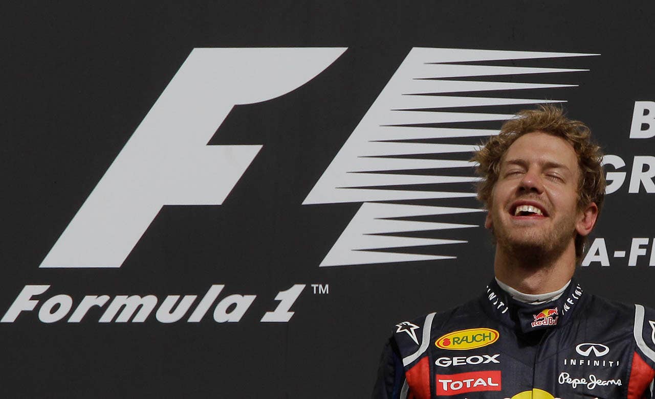 Red Bull driver Sebastian Vettel of Germany reacts after winning  the Belgian F1 Grand Prix at the Spa-Francorchamps circuit in Spa-Francorchamps, Belgium, Sunday, Aug. 28, 2011.   (AP Photo/Frank Augstein)