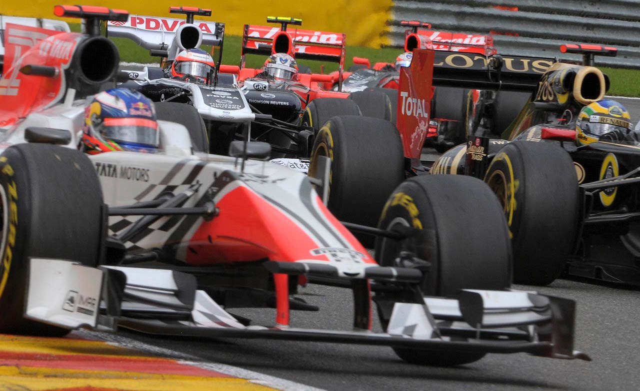 Drivers steer their car at the Belgian Formula One Grand Prix in Spa-Francorchamps, Sunday, Aug. 28, 2011. Red Bull driver Sebastian Vettel of Germany won the race, Red Bull driver Mark Webber of Australia placed second, and McLaren Mercedes driver Jenson Button of Britain placed third. (AP Photo/Geert Vanden Wijngaert)