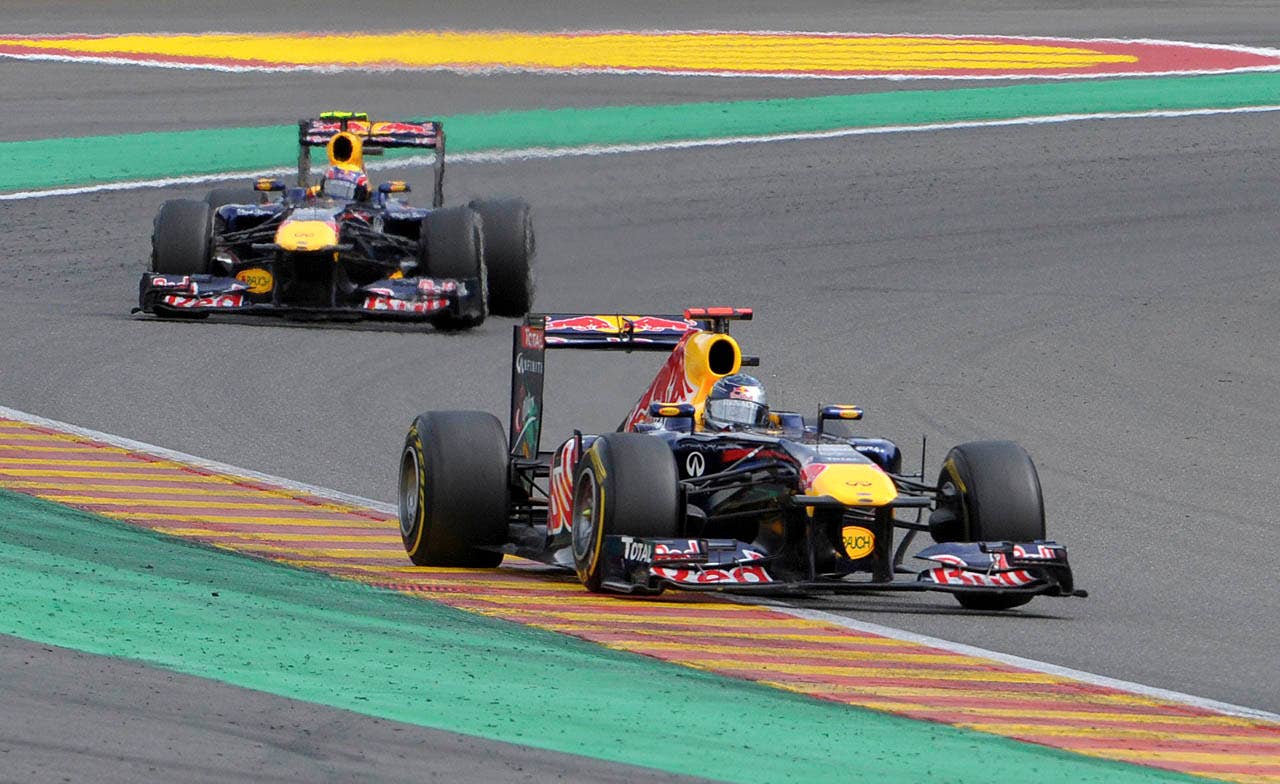 Red Bull driver Mark Webber of Australia, background, chases Red Bull driver Sebastian Vettel of Germany during the Belgian Formula One Grand Prix in Spa-Francorchamps, Sunday, Aug. 28, 2011. Red Bull driver Sebastian Vettel of Germany won the race, Red Bull driver Mark Webber of Australia placed second, and McLaren Mercedes driver Jenson Button of Britain placed third. (AP Photo/Geert Vanden Wijngaert)