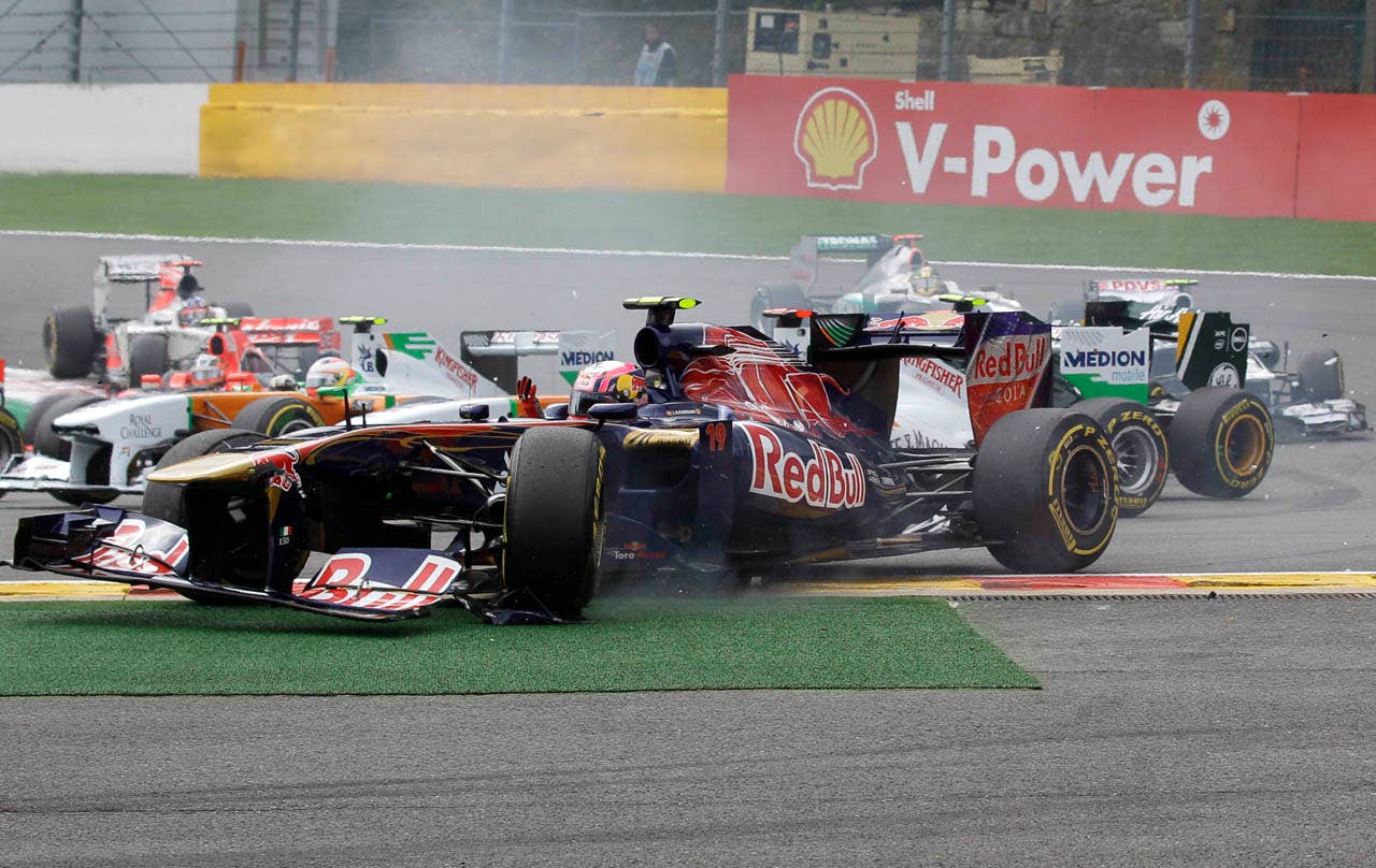 Toro Rosso driver Jaime Alguersuari of Spain gestures as he was hit by another car at the start of the Belgian Formula One Grand Prix in Spa-Francorchamps, Sunday, Aug. 28, 2011. (AP Photo/Frank Augstein)
