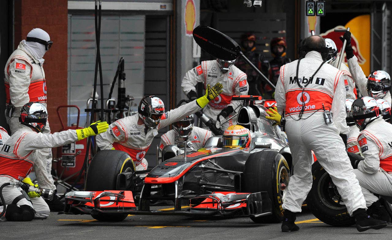 McLaren Mercedes driver Lewis Hamilton of Britain has a service check prior to crash during the Belgian Formula One Grand Prix in Spa-Francorchamps, Sunday, Aug. 28, 2011. Red Bull driver Sebastian Vettel of Germany won the race, Red Bull driver Mark Webber of Australia placed second, and McLaren Mercedes driver Jenson Button of Britain placed third. (AP Photo/Dimitar Dilkoff, pool)
