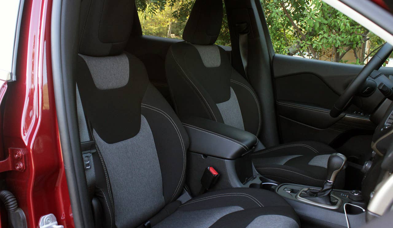 Sticker Price: $27,995 Invoice Price: $27,056 Fuel Economy: 22 mpg City, 31 mpg Highway  Everything inside the newly redesigned Jeep Cherokee has seen a rise in quality. Though the tough SUV doesn't come with lamb's wool floor mats, the plastics and vinyl are soft and smooth. The steering wheel in the Limited edition comes wrapped in thick leather, and the plastic door pulls are made from heavy duty plastic and feels close to real metal. Even the cloth seats, usually a sure sign of a cheaper car, are made from high quality fabric inspired by the thick outer coverings worn by Scandinavians. The Icelandic-themed material is laid over firm, thick foam. This Jeep crams as much storage as possible, giving this interior function as well as form.  Research the Jeep Cherokee Limited Jeep Cherokee Limited Overview Jeep Cherokee Limited Photos & Video Local Dealer Price Quote