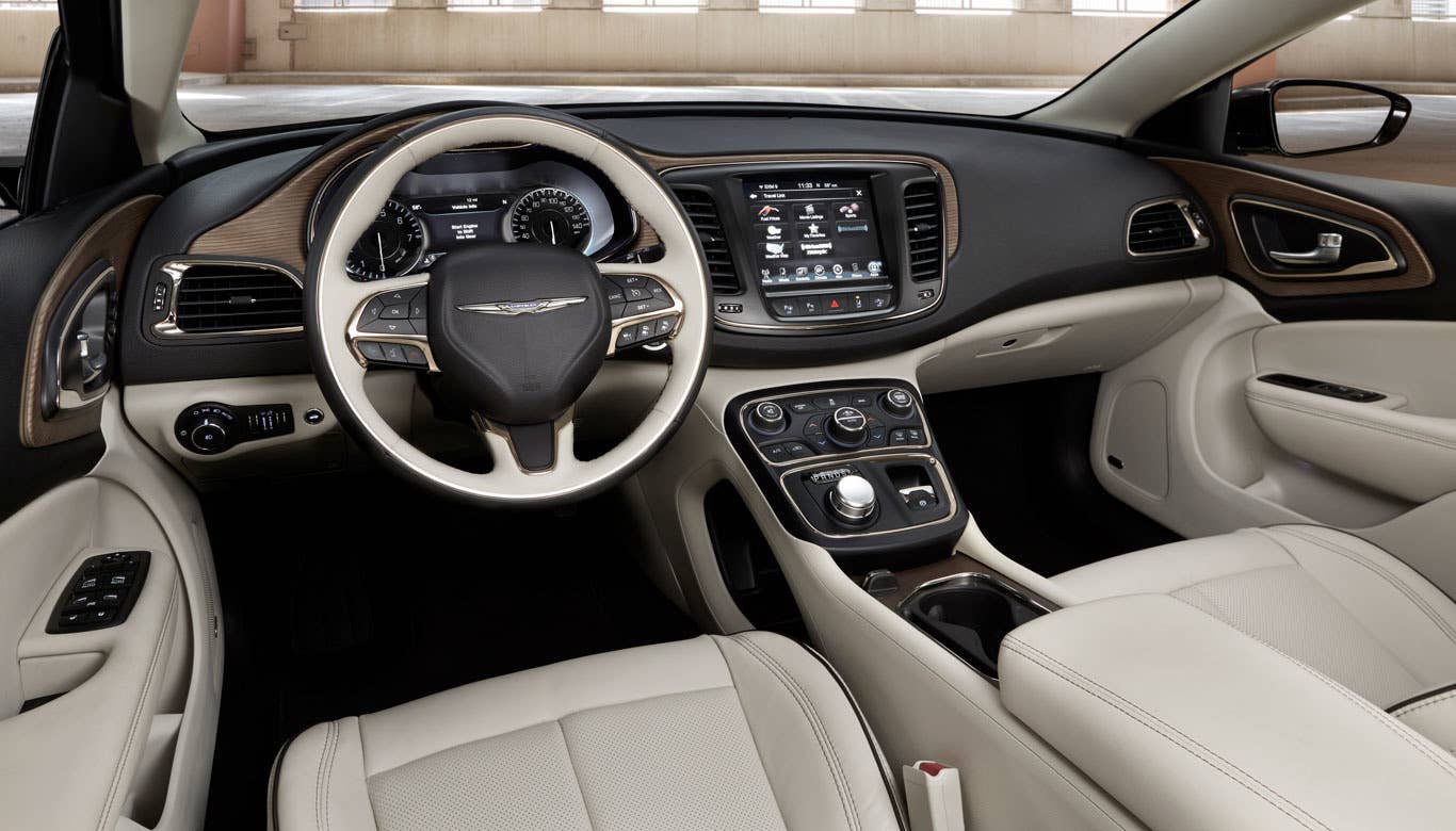 Sticker Price: $25,995 - $30,195 Invoice Price: $25,166 - $29,072 Fuel Economy: N/A  TheChrysler 200C is an ugly duckling that reached swan status this year, and not just with its exterior. There are three color schemes to choose from with the cabin, inspired by the city skylines of Detroit, New York and Sausalito, Calif. There's also a Premium Group available for the 200C that adds a heated, two-tone steering wheel, as well as stylish, real wood accents. Those veneer trims, in particular, look quite intriguing, with the bluish-silver wood having an almost metallic appearance. The five-inch TFT display in the instrument cluster comes standard and can be totally reconfigured to fit the needs of the driver.  Research the Chrysler 200C Chrysler 200C Overview Chrysler 200C Photos & Video Local Dealer Price Quote