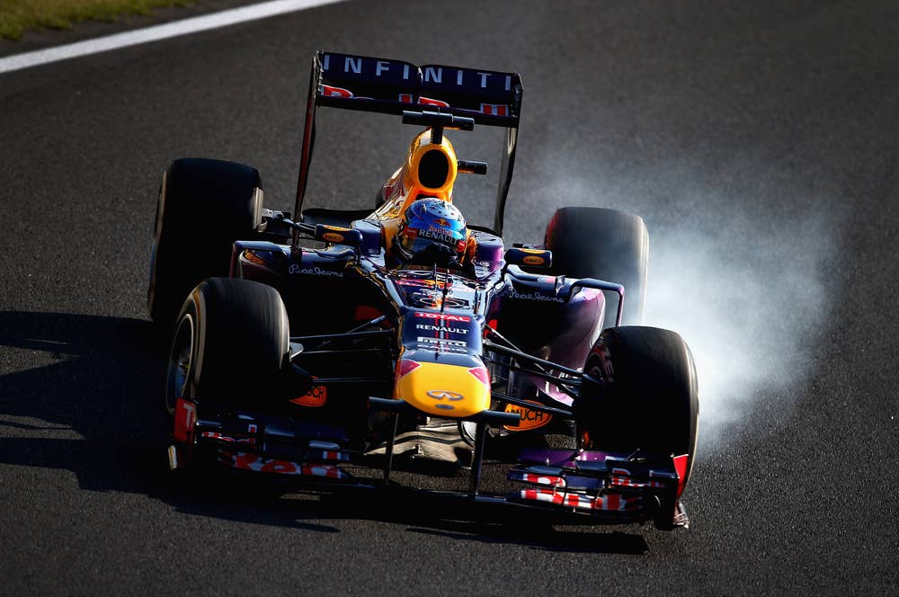 SUZUKA, JAPAN - OCTOBER 13:  Sebastian Vettel of Germany and Infiniti Red Bull Racing drives on his way to winning the Japanese Formula One Grand Prix at Suzuka Circuit on October 13, 2013 in Suzuka, Japan.  (Photo by Clive Mason/Getty Images)