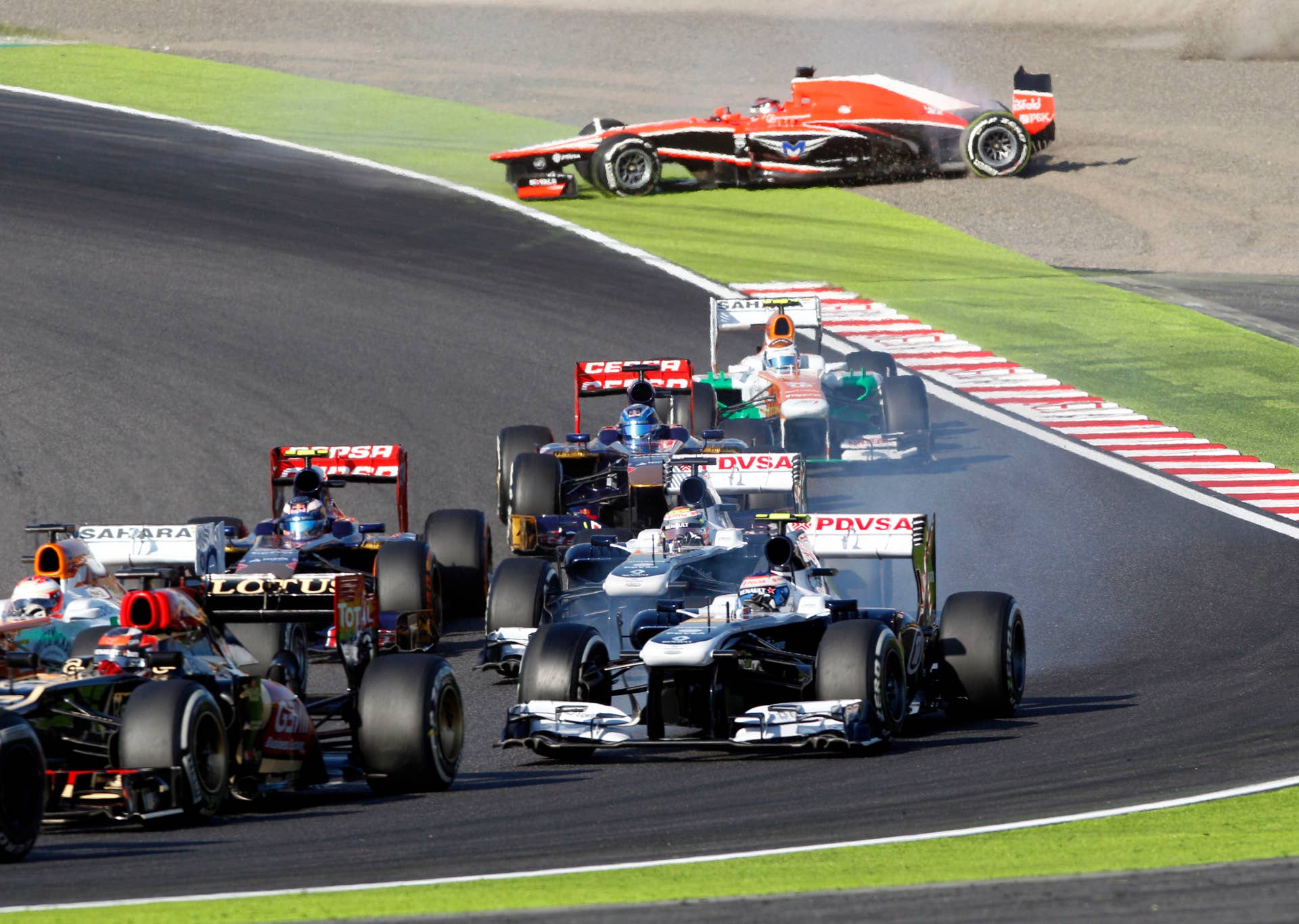 Marussia driver Jules Bianchi of France slides off the track after colliding with Caterham driver Giedo van der Garde of the Netherlands during the Japanese Formula One Grand Prix at the Suzuka circuit in Suzuka, Japan, Sunday, Oct. 13, 2013. (AP Photo/Greg Baker)