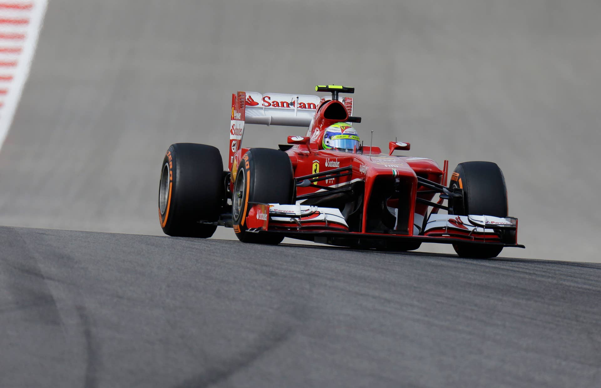 Ferrari driver Felipe Massa of Brazil makes his way to the first turn during the qualifying session for the Formula One U.S. Grand Prix auto race at the Circuit of the Americas, Saturday, Nov. 16, 2013, in Austin, Texas. (AP Photo/Eric Gay)