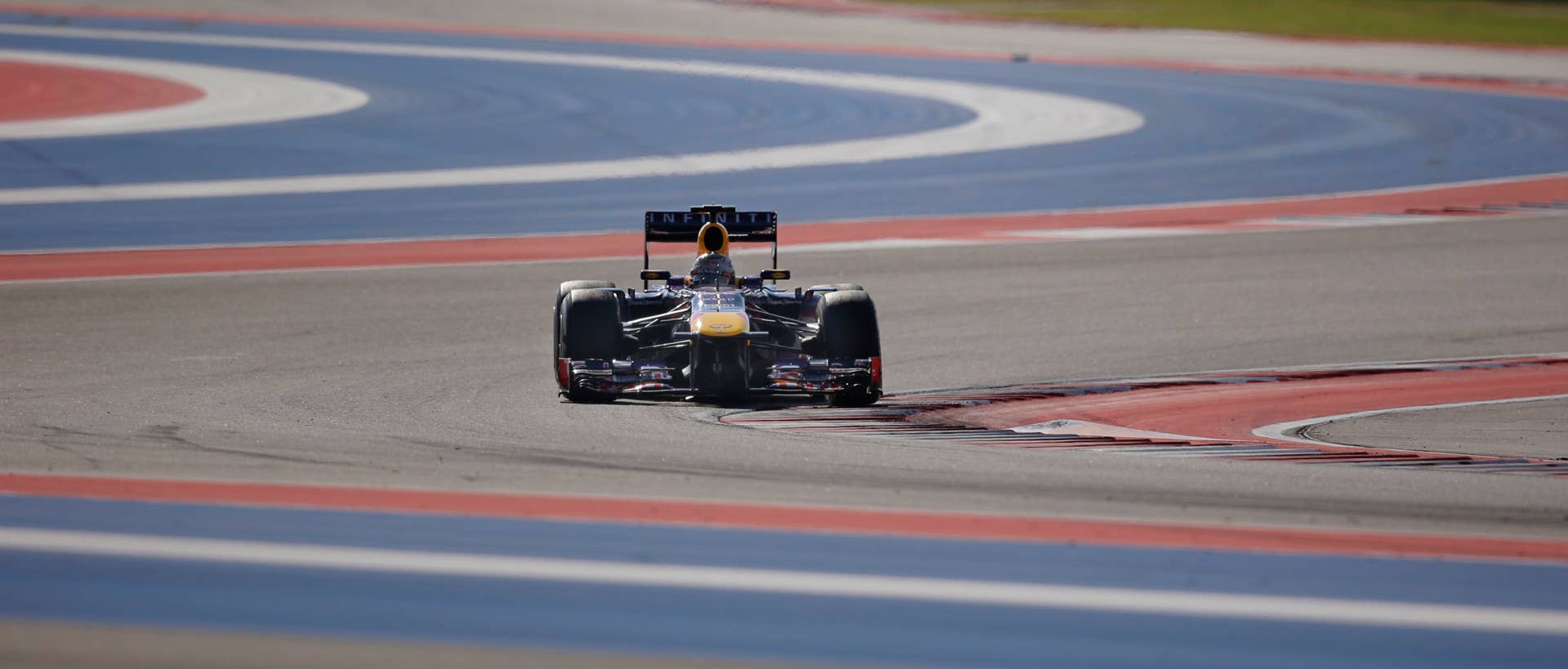 Red Bull driver Sebastian Vettel of Germany races during the Formula One U.S. Grand Prix auto race at the Circuit of the Americas, Sunday, Nov. 17, 2013, in Austin, Texas. (AP Photo/Eric Gay)