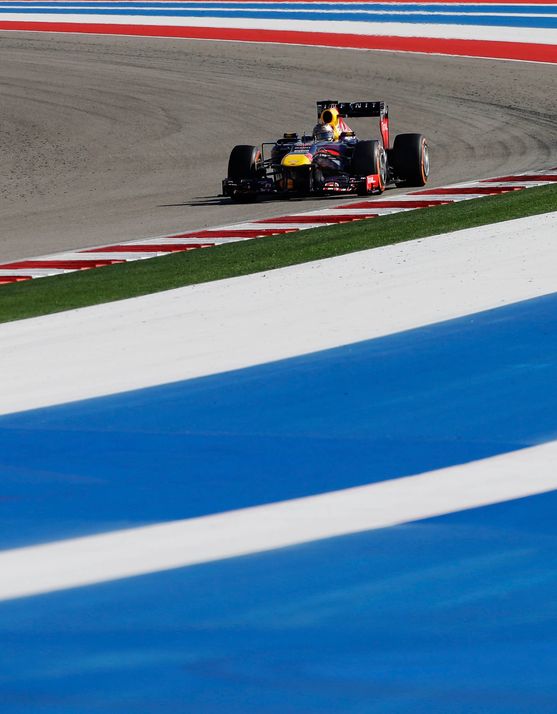 Red Bull driver Sebastian Vettel of Germany races during the Formula One U.S. Grand Prix auto race at the Circuit of the Americas, Sunday, Nov. 17, 2013, in Austin, Texas. (AP Photo/David J. Phillip)