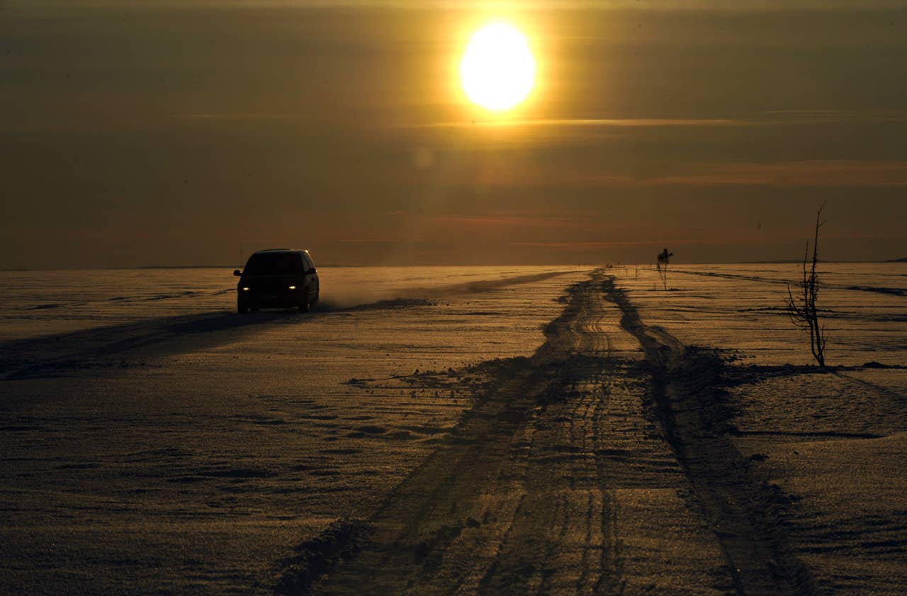 A car drives on February 17, 2011 on the longest ice road in Europe in Estonia. The 26.5 kms road in western Estonia, which links the mainland to the country's second largest island of Hiiumaa, is to open on February 18 when the ice is thick enough. AFP PHOTO / RAIGO PAJULA
