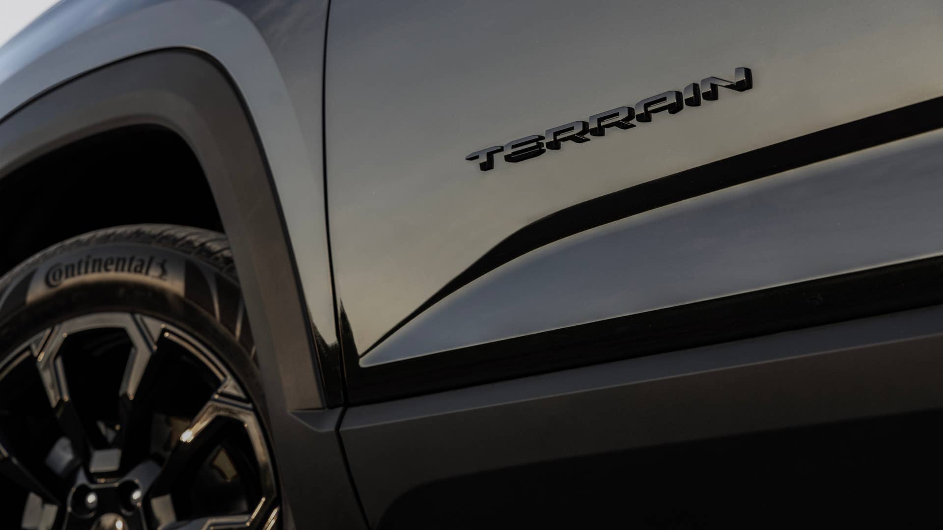 Close-up of the next-generation 2025 GMC Terrain Elevation Black Edition’s door badging.