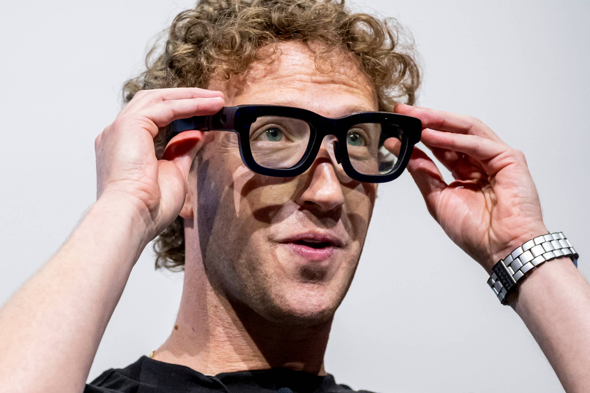 Mark Zuckerberg, chief executive officer of Meta Platforms Inc., wears Orion augmented reality (AR) glasses during the Meta Connect event in Menlo Park, California, US, on Wednesday, Sept. 25, 2024. Meta Platforms Inc. debuted its first pair of augmented reality glasses, devices that show a combined view of the digital and physical worlds, a key step in Chief Executive Officer Mark Zuckerberg's goal of one day offering a hands-free alternative to the smartphone. Photographer: David Paul Morris/Bloomberg via Getty Images
