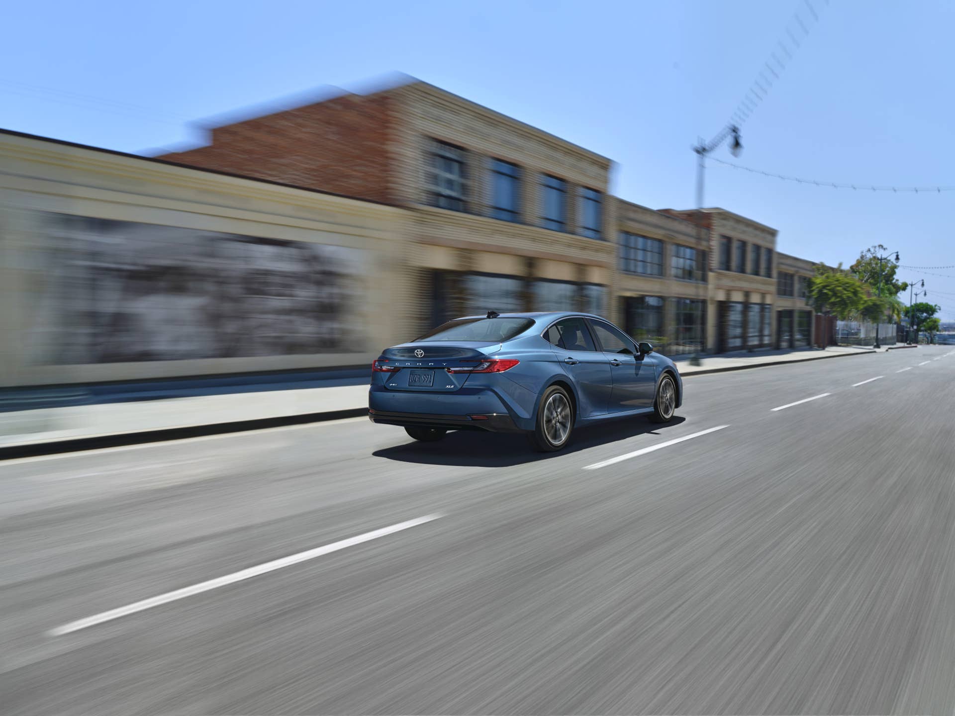 rear shot of a Toyota Camry XLE driving at speed