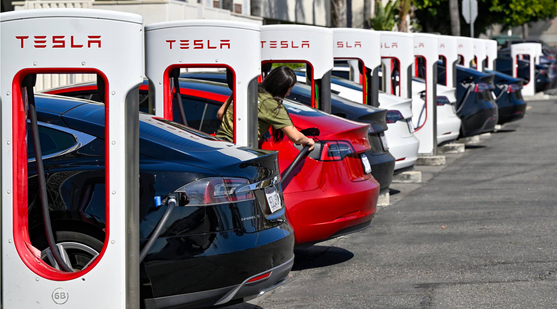 Santa Ana, CA - March 20: Drivers charge their Teslas in Santa Ana, CA, on Wednesday, March 20, 2024. The Biden administration on Wednesday, March 20, 2024, issued one of the most significant climate regulations in the nation's history, a rule designed to ensure that the majority of new passenger cars and light trucks sold in the United States are all-electric or hybrids by 2032. (Photo by Jeff Gritchen/MediaNews Group/Orange County Register via Getty Images)