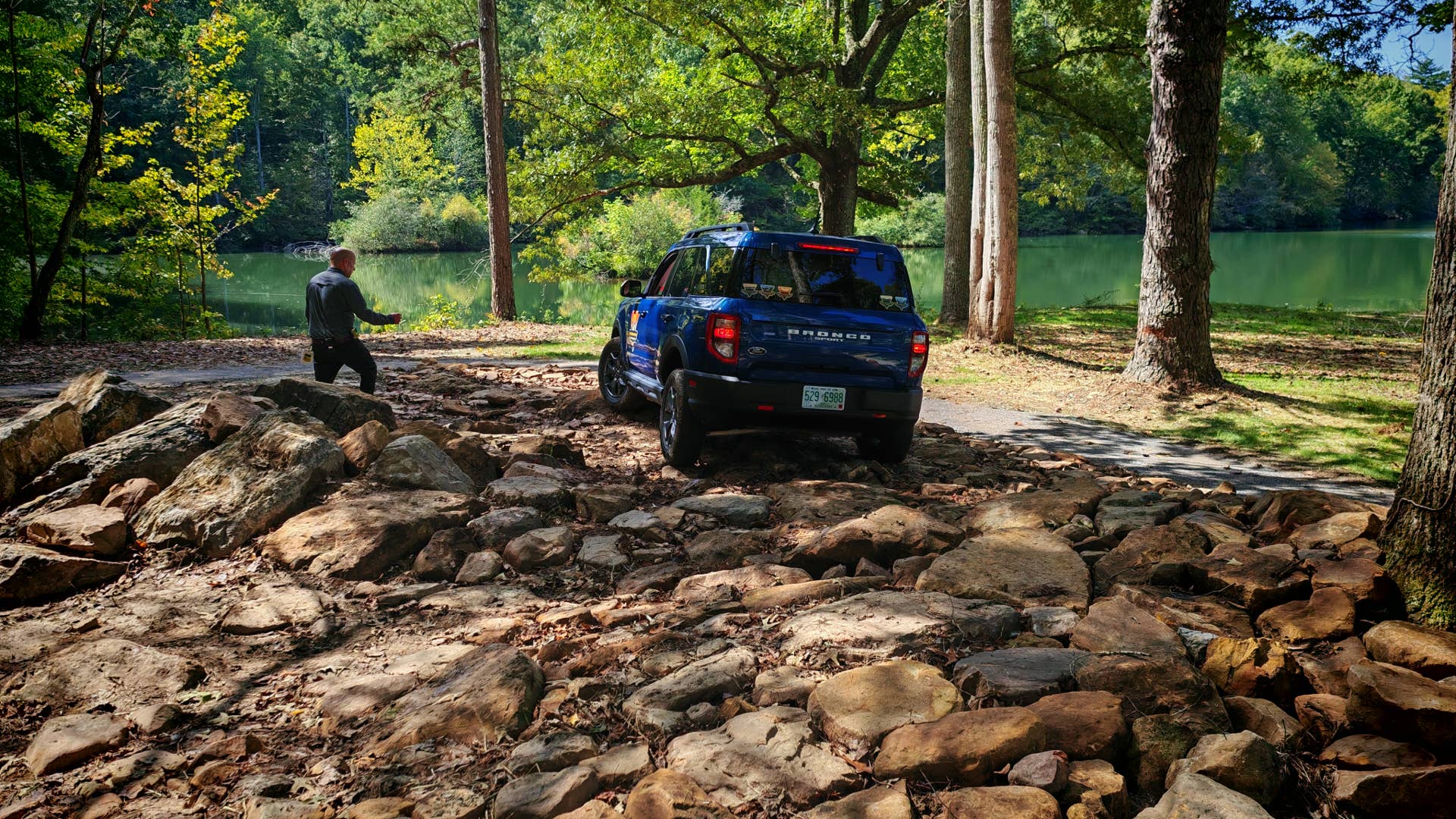A blue Ford Bronco Sport in the rocky part of the training area