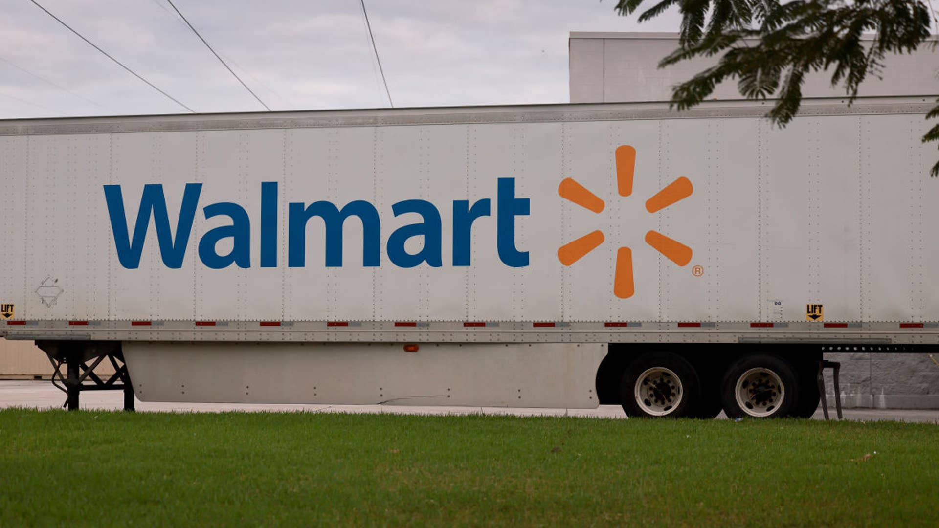 MIAMI, FLORIDA - A Walmart sign is displayed on the side of a trailer in Miami, Florida