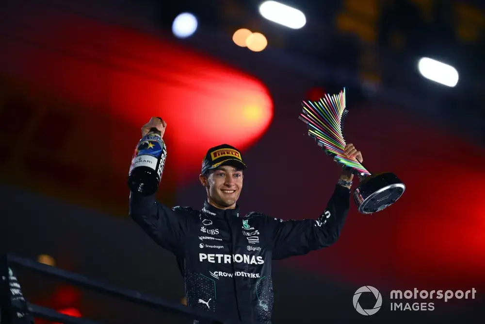 George Russell, Mercedes-AMG F1 Team, 1st position, on the podium with his trophy and Champagne