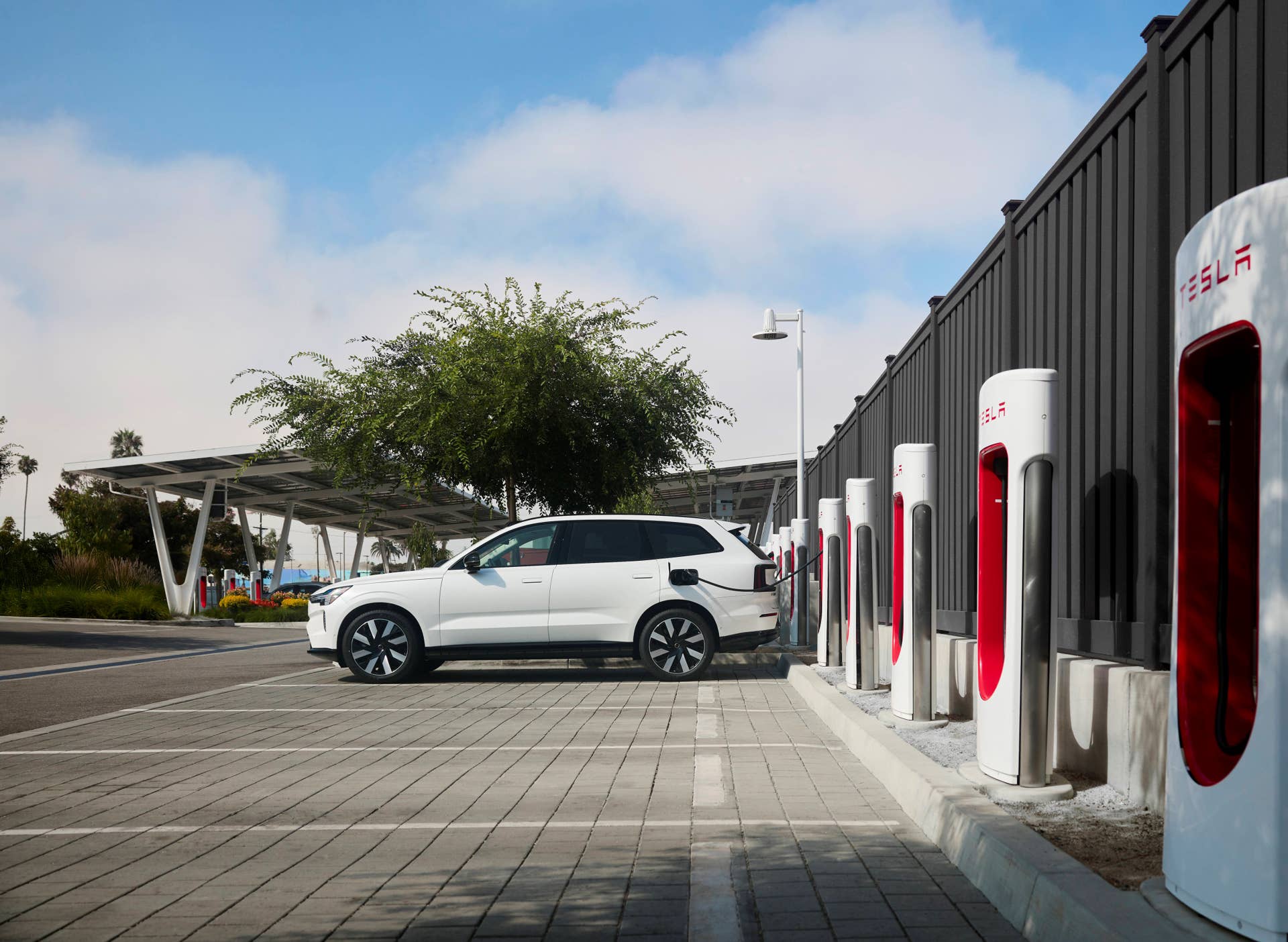 Volvo EV SUV at Tesla Supercharger