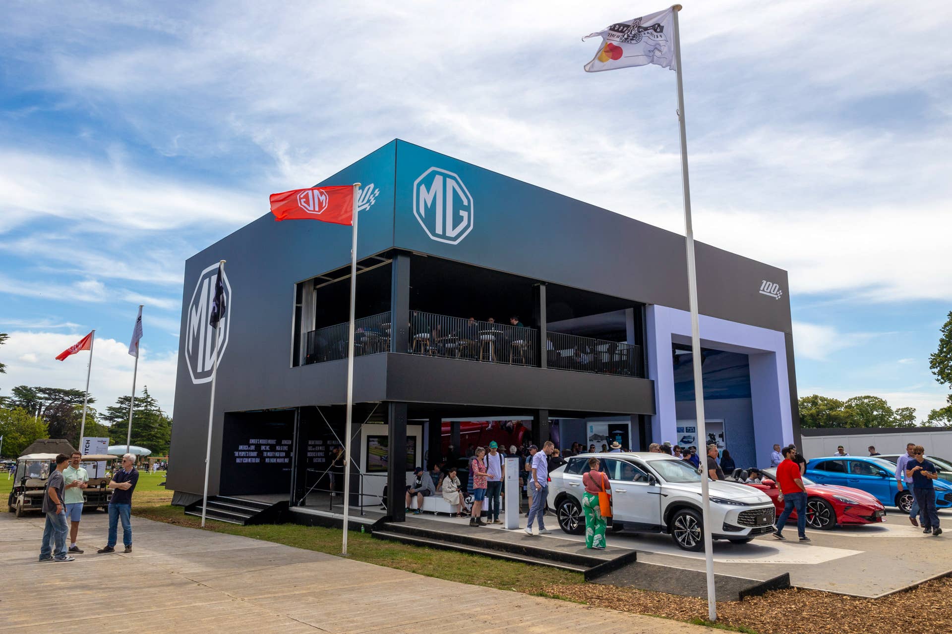 Visitors at SAIC Motor Corp.'s MG stand at the Goodwood Festival of Speed in Goodwood, UK, on Thursday, July 11, 2024. Chinese carmakers have flocked to the show in a bid to broaden their appeal to European consumers after their initial growth in the market slowed. Photographer: Carlos Jasso/Bloomberg via Getty Images.
