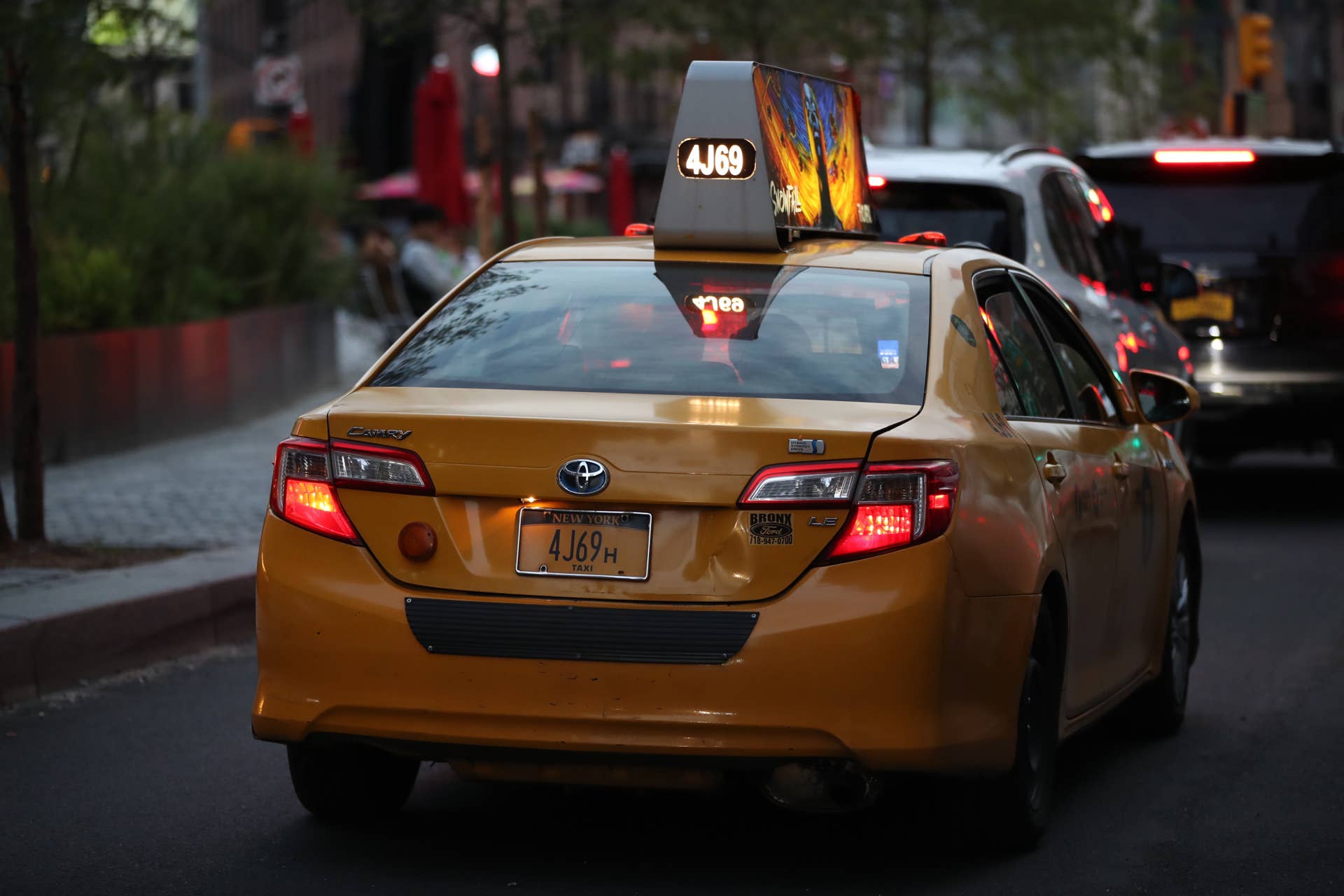 A taxi shown navigating New York City streets
