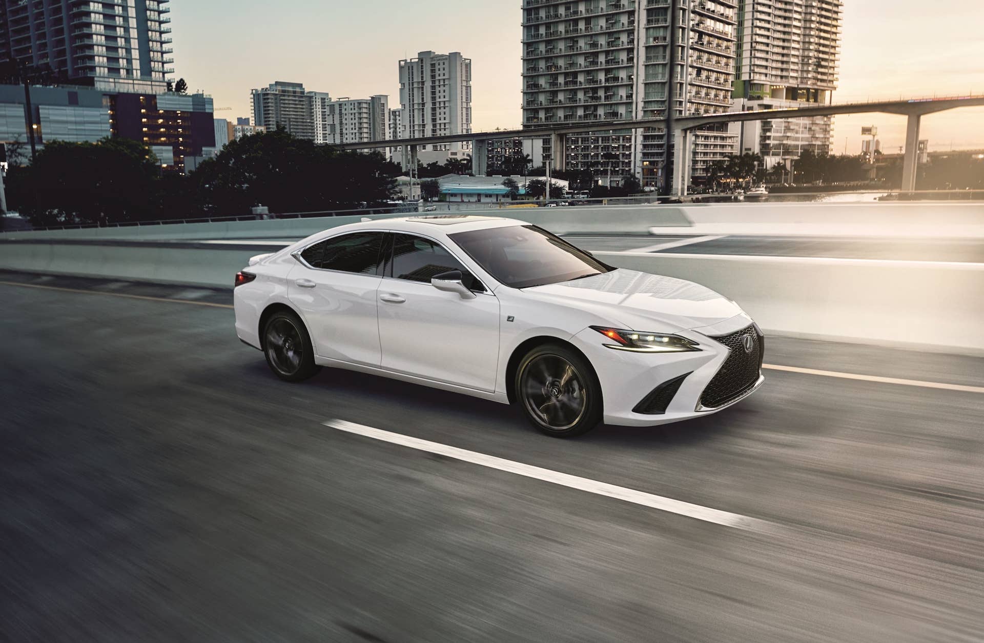 2025 Lexus ES 350 in white front angled view driving