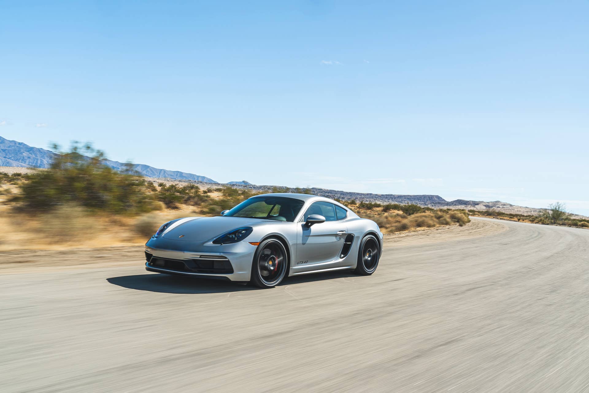 2025 Porsche Cayman GTS front angled view driving