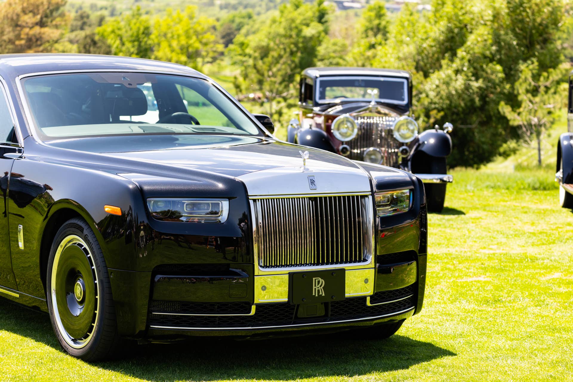 Front view of a Rolls-Royce Phantom, old and new.