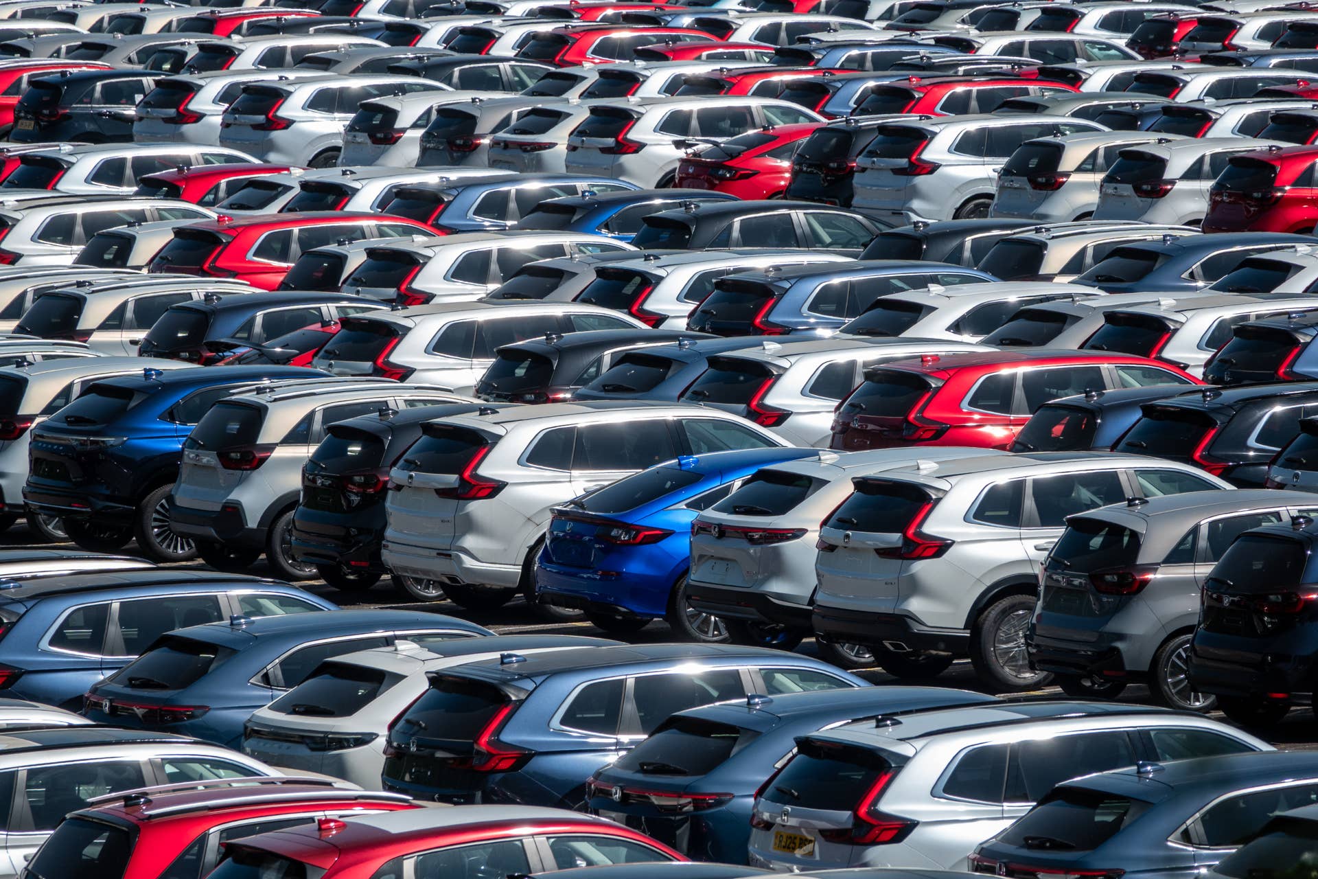 Recently imported new Honda cars parked in a storage yard