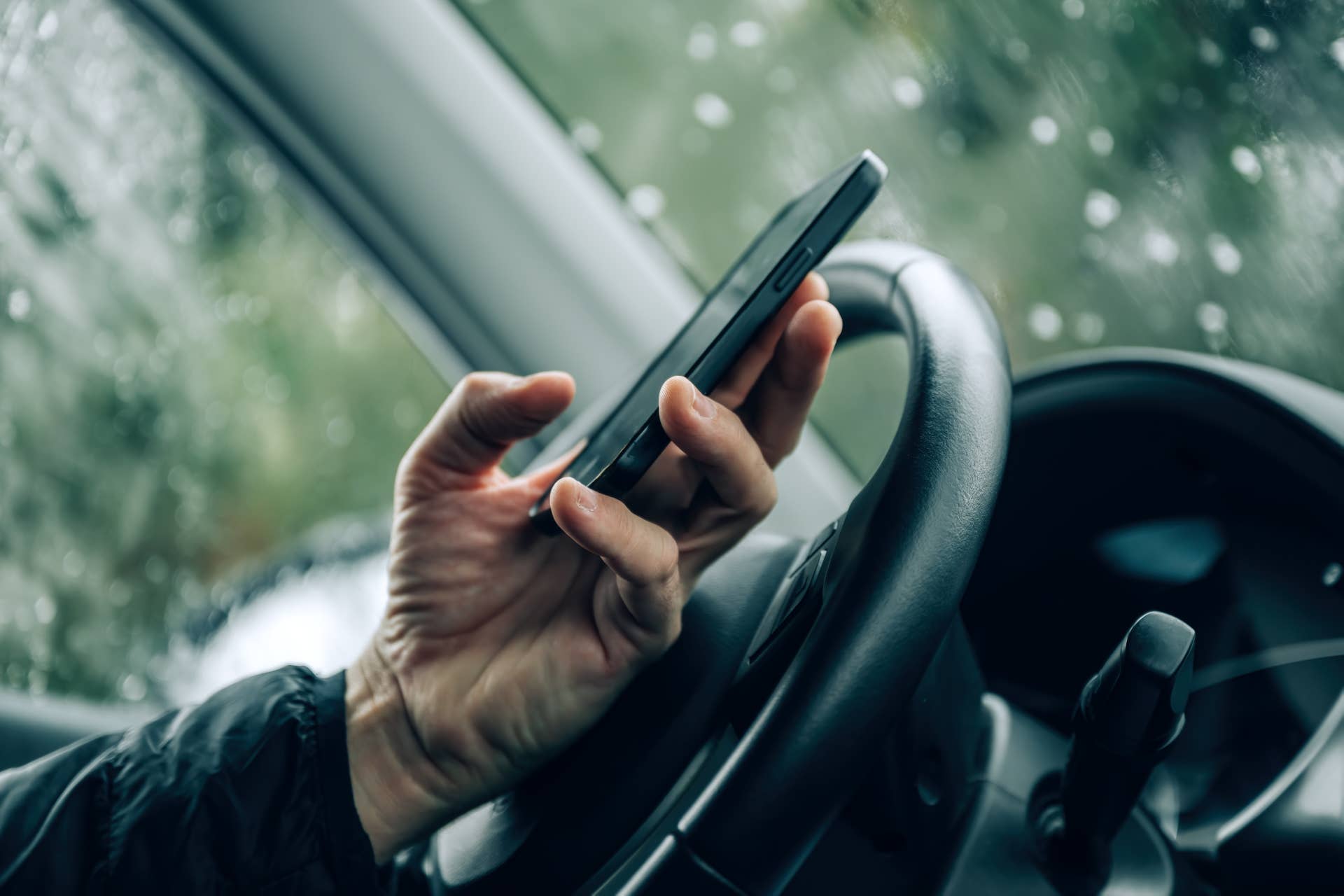 Man texting while driving