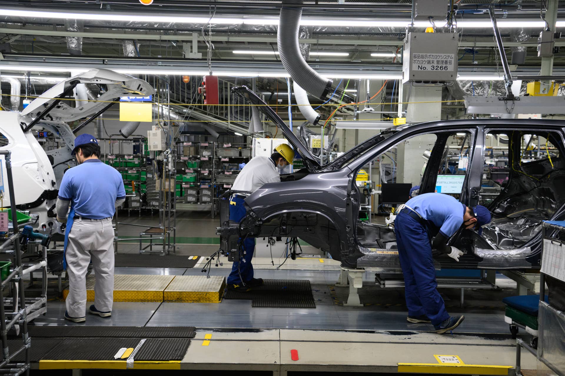 Workers assemble vehicles on the production line at the Subaru Corp. Gunma Yajima Plant in Ota, Gunma Prefecture, Japan.