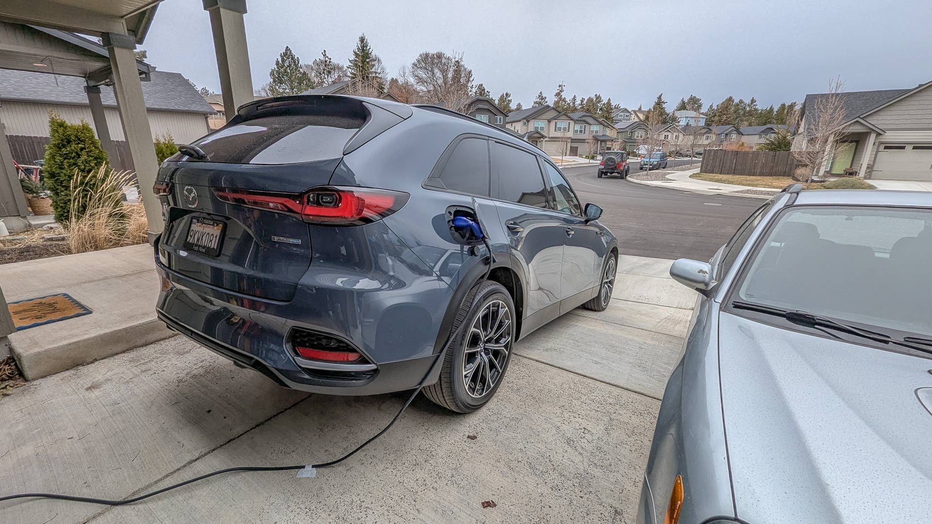 The CX-70 charging in my driveway