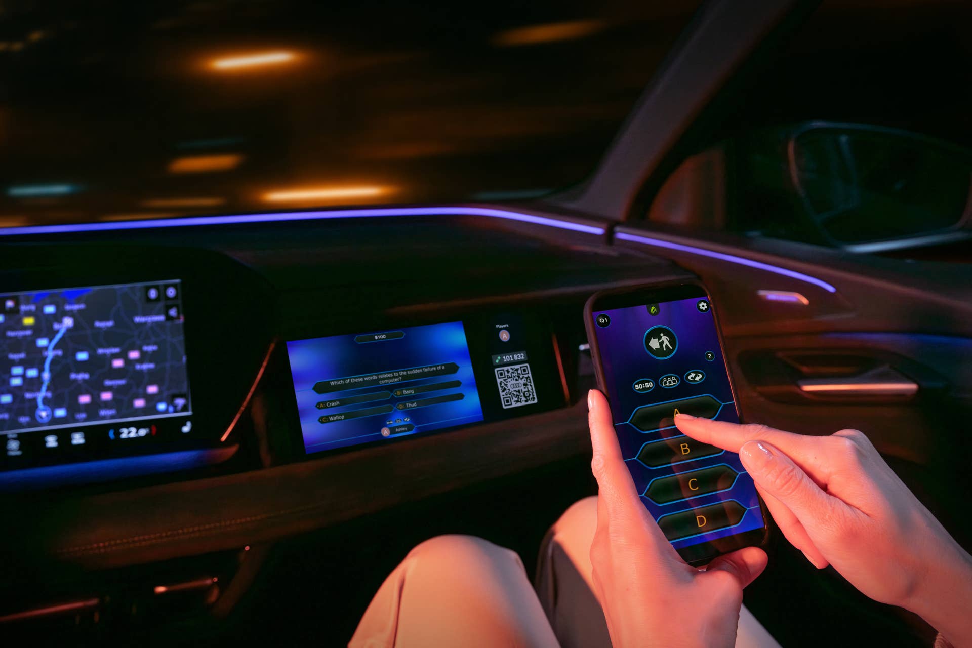 The AirConsole gaming platform app and the game Who Wants to Be a Millionaire? run on the front passenger display in an Audi.