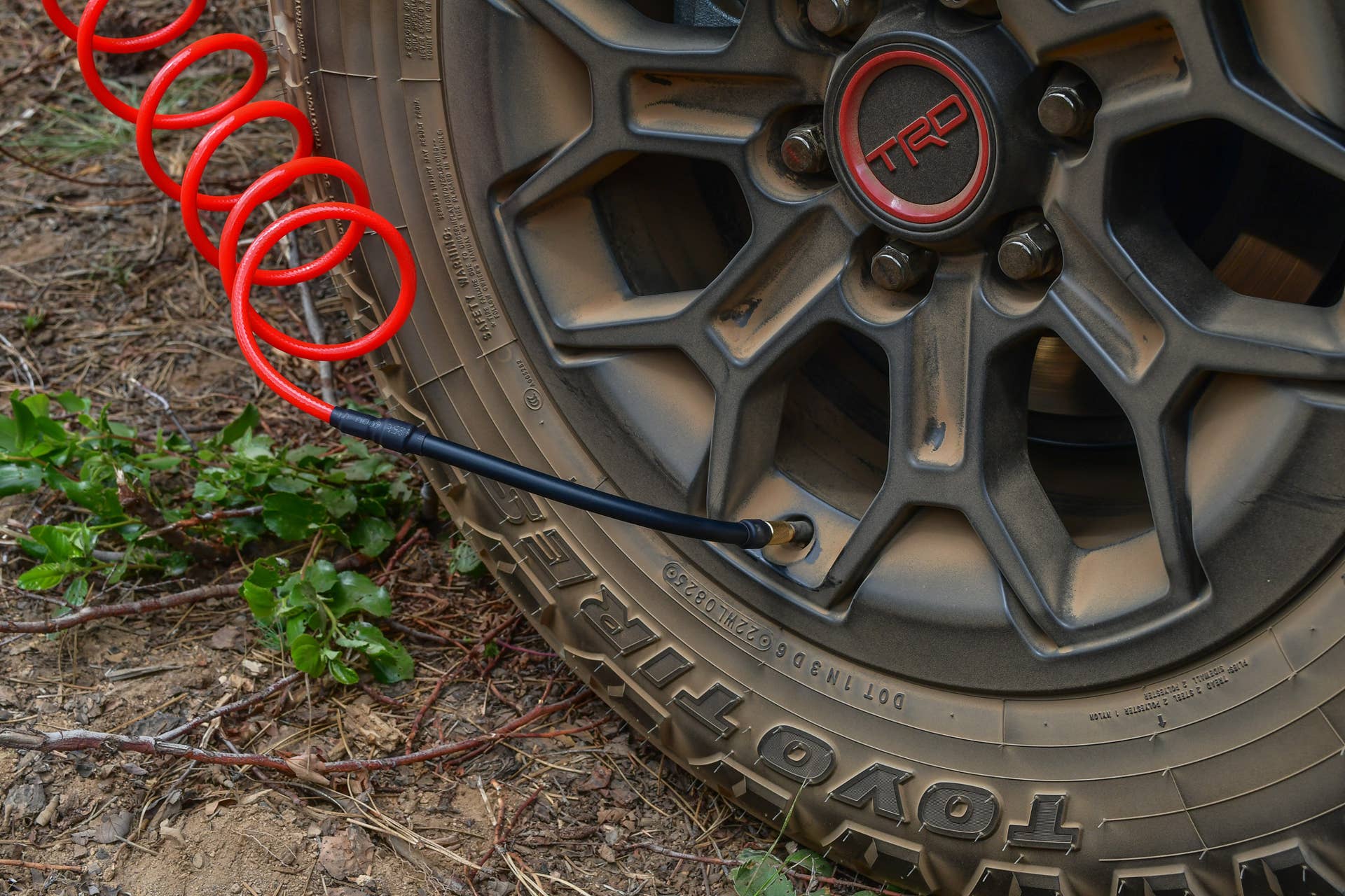 The integrated compressor being used on a rear tire of the 2025 Toyota 4Runner TRD Pro