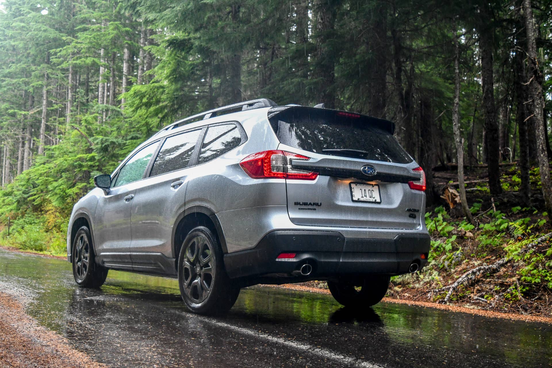 2025-2026 Subaru Ascent silver rear angled view driving