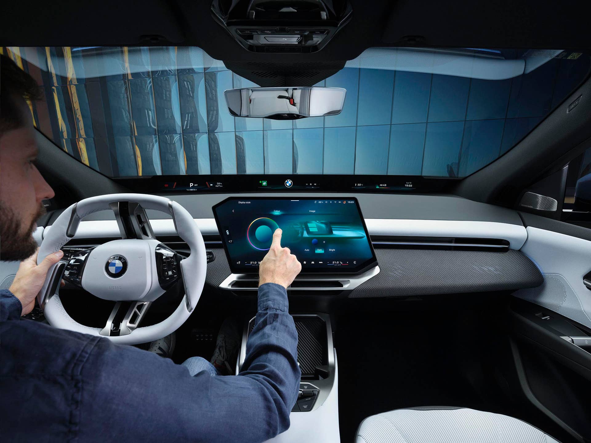BMW iX3 - driver operating touchscreen