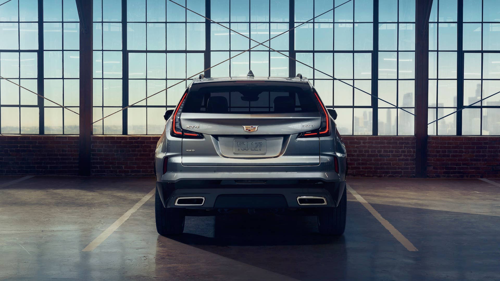 Rear view of the 2025 Cadillac XT4 Sport in Argent Silver Metallic.