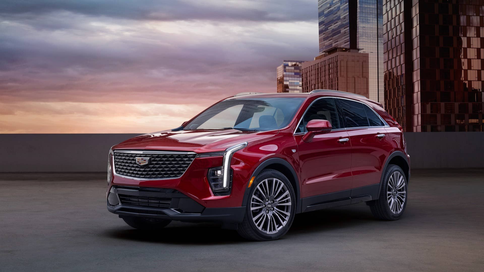 View of the 2025 Cadillac XT4 Premium Luxury in Radiant Red Metallic showing off its curated design updates with a new grille design, refreshed LED headlamps and all-new alloy wheels.