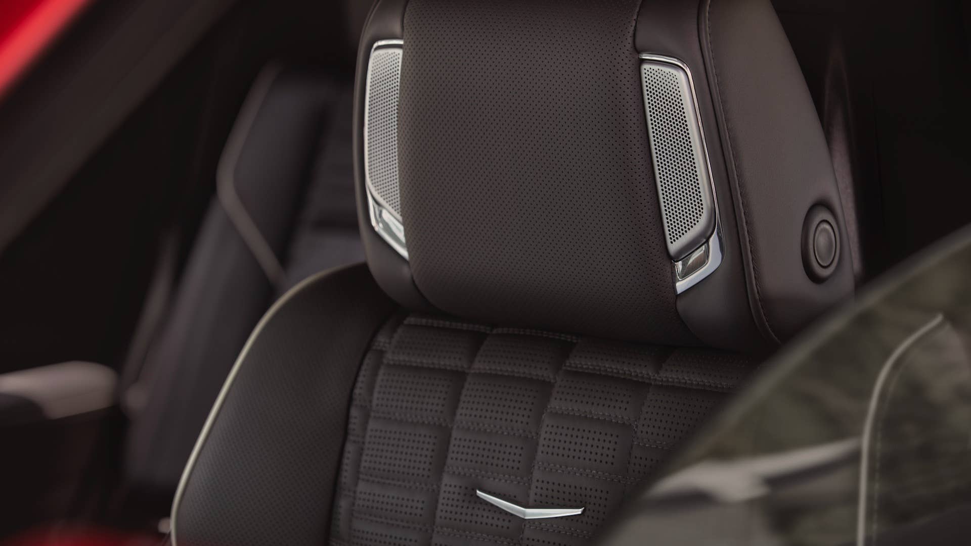 Close-up shot of the top of seat and headrest with AKG speakers in the 2025 Cadillac Escalade-V.