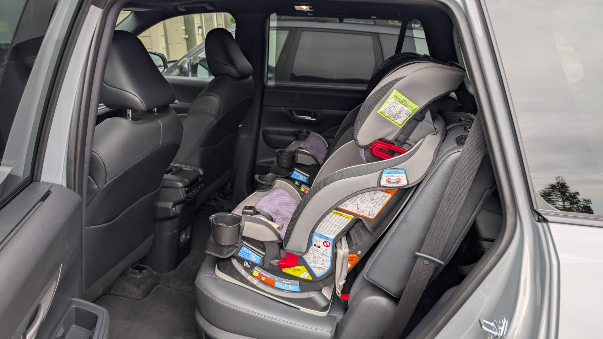 The rear seats of the 2025 Toyota Grand Highlander with car seats installed