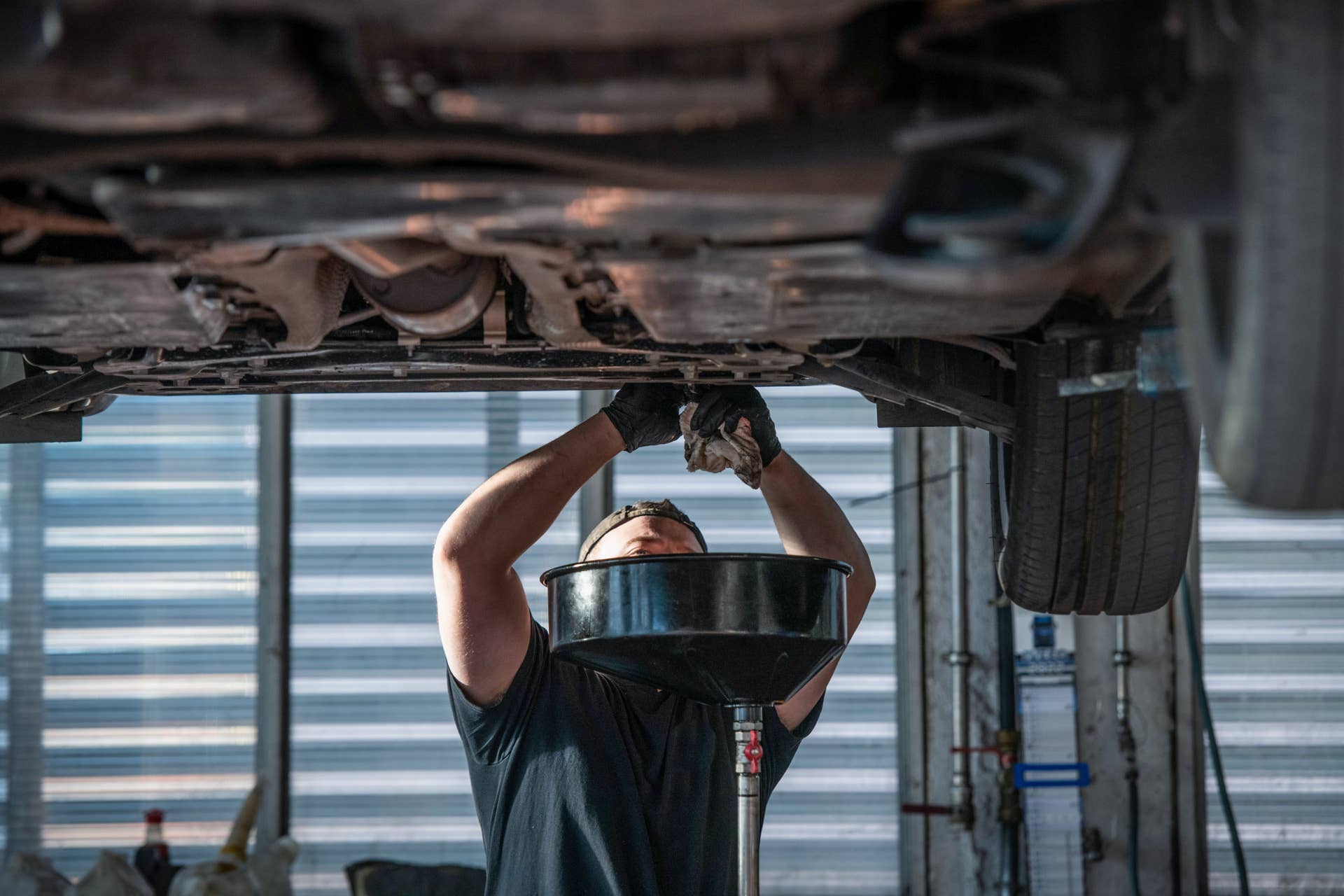 Mechanic performing an oil change