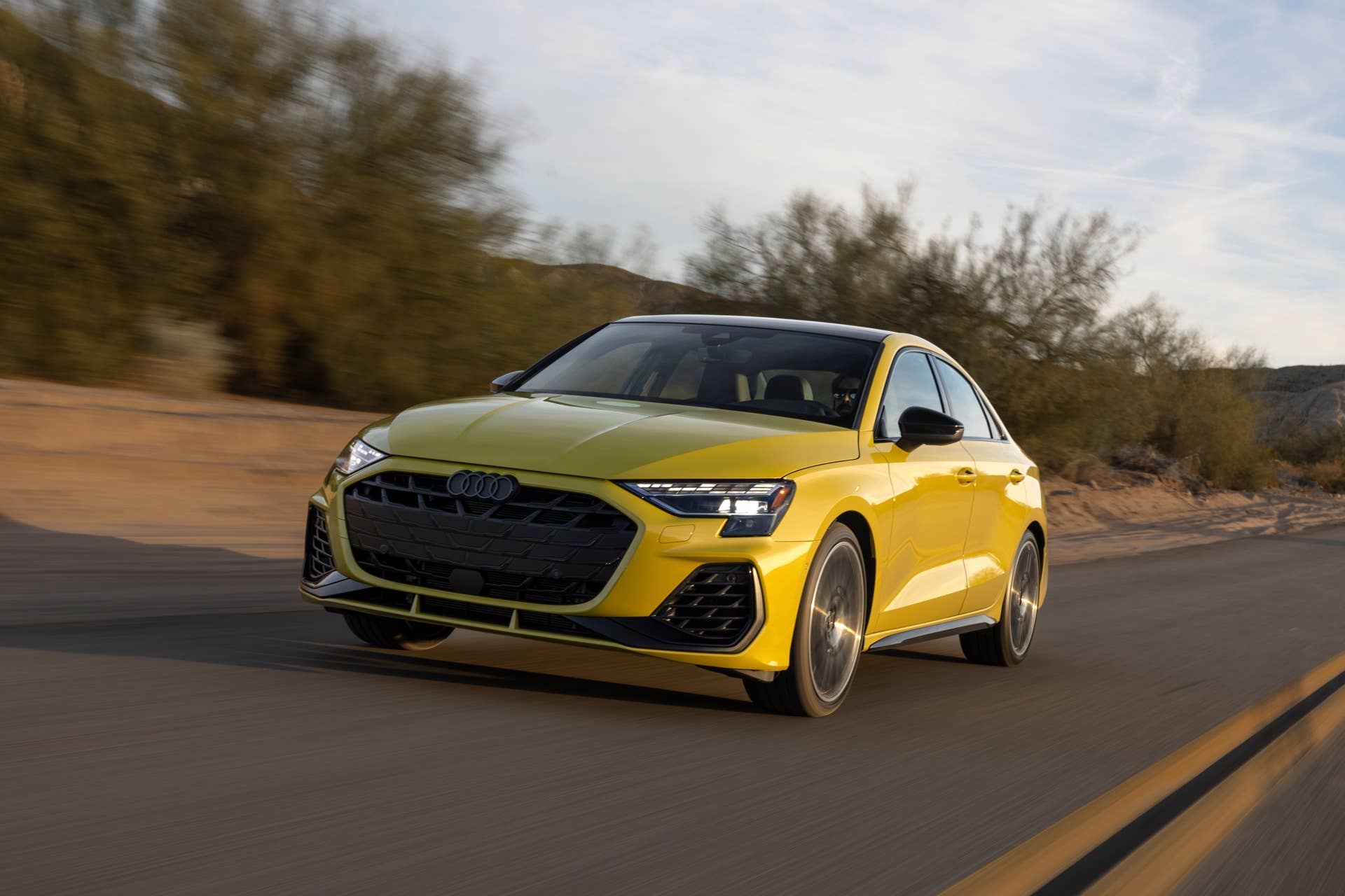 2025 Audi S3 yellow front angled view driving