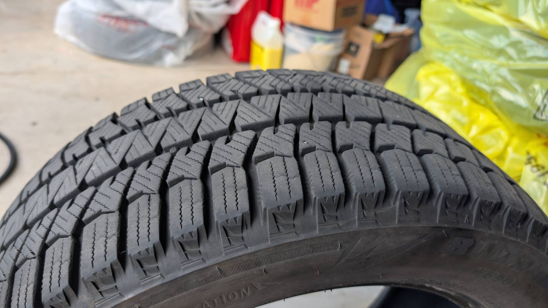 The tread of a Bridgestone Blizzak dedicated winter tire