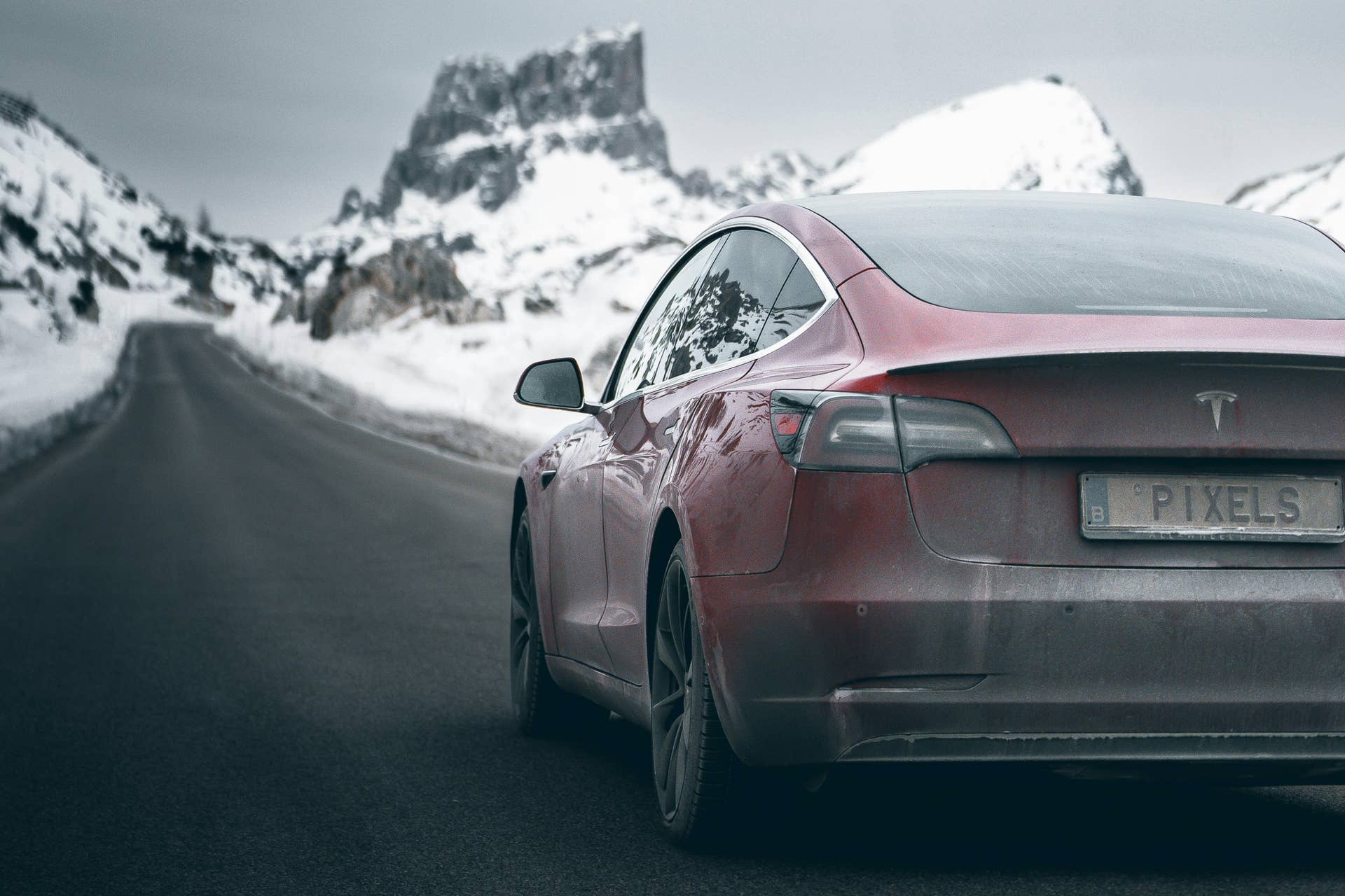 a Tesla driving in the snow