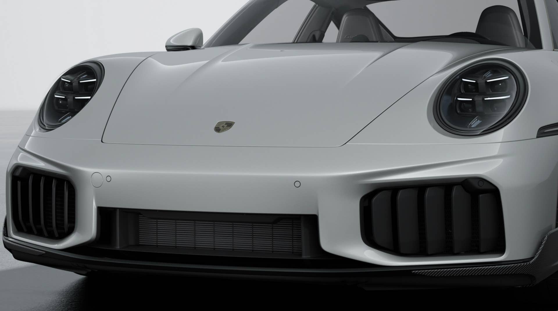 2026 Porsche 911 Turbo S with SportDesign package in carbon fiber nose closeup